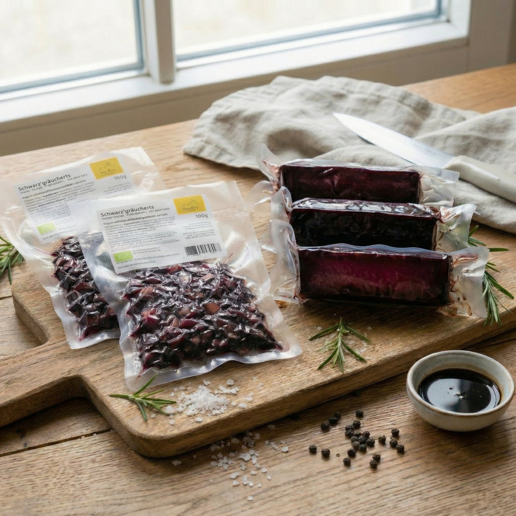 The Anna Meru Alpine Chef's Bundle featuring packaged vegan smoked blocks and cubes displayed on a rustic wooden board.